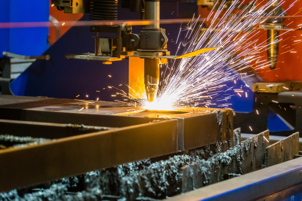 A closeup shot of sparks flying from an industrial steel cutter
